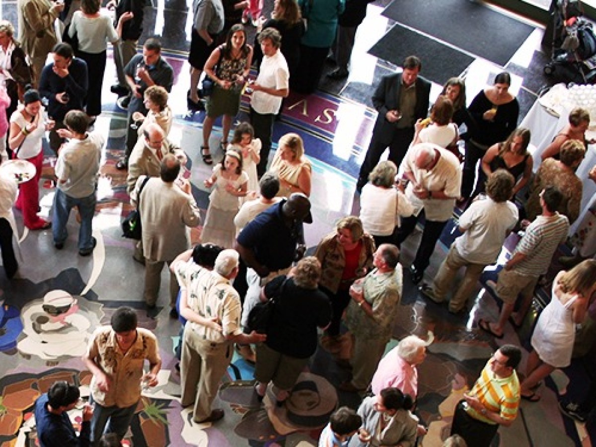 Crowd of people socialising at an event