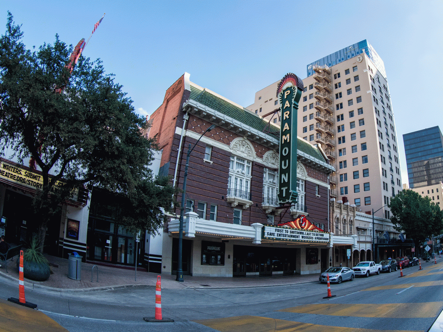 AO Tours Austin Hard Top Bus in front of a building