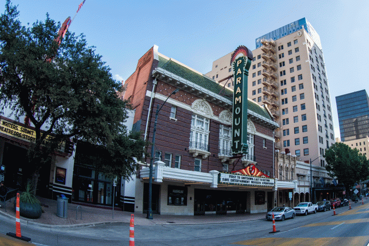 AO Tours Austin Hard Top Bus in front of a building