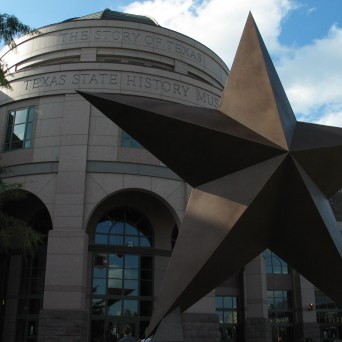 Round building with a big bronze star in front