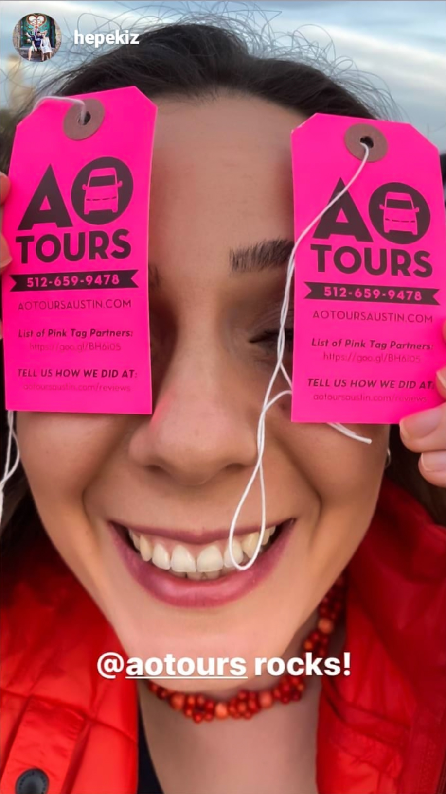 AO_Tours_Pink_Tags a woman holding AO Tours Austin Pink Luggage Tagsposing for the camera