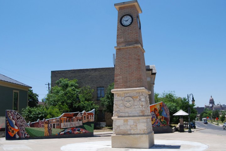 a clock tower in the middle of a brick building