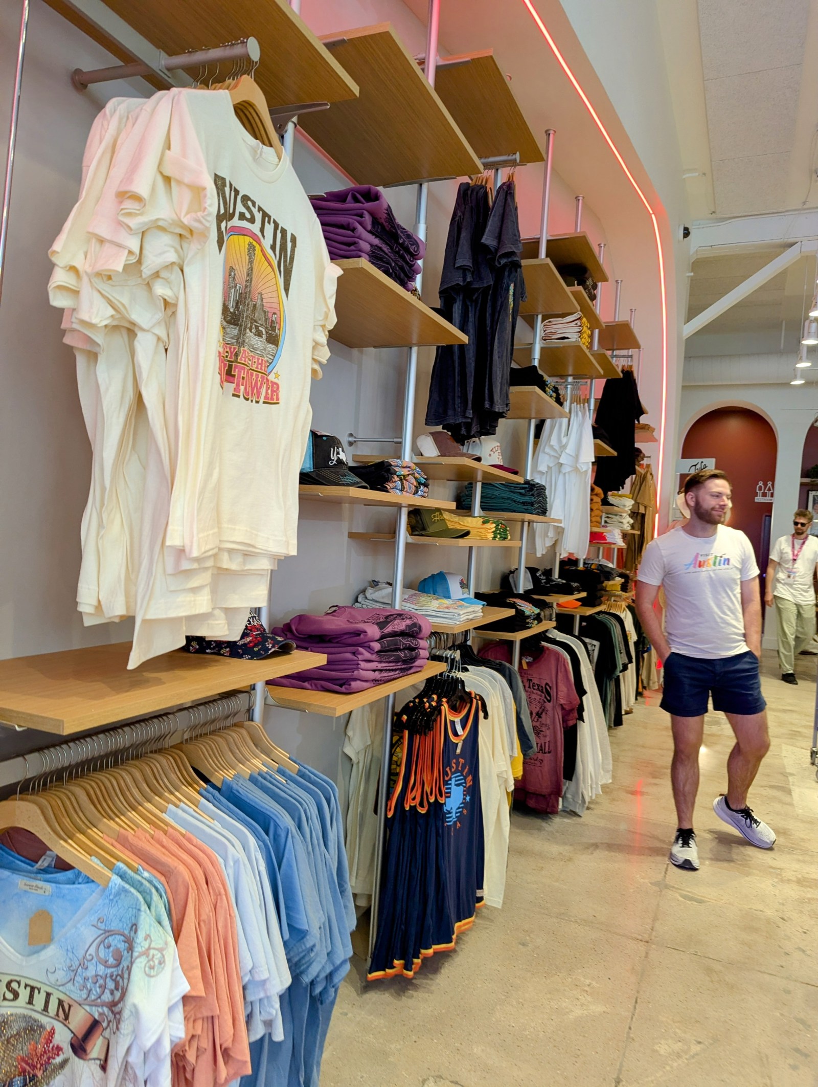 T-shirts and other clothing items on display at Austin Visitor Center.