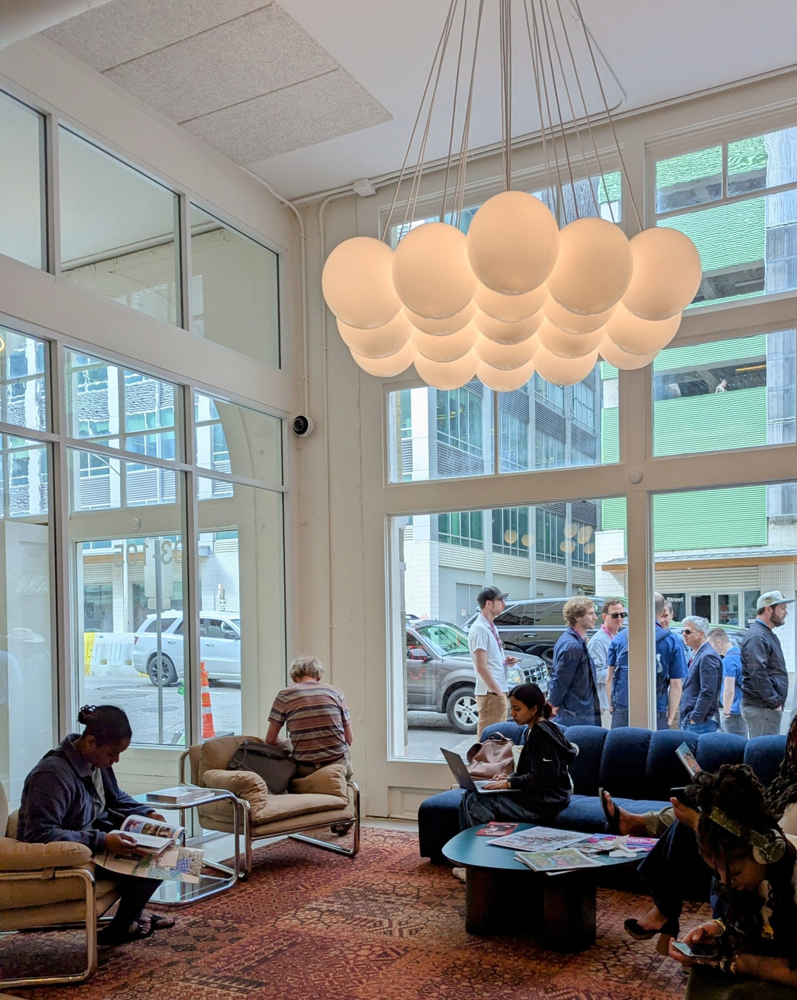 A group of people waiting in the lobby of the Austin Visitor Center.